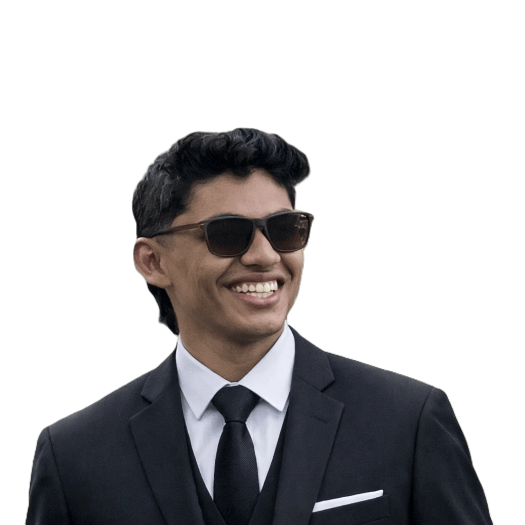Digital marketing freelancer in Calicut Sanish Muhammed wearing a black suit and sunglasses, smiling in a professional profile photo for a personal website.